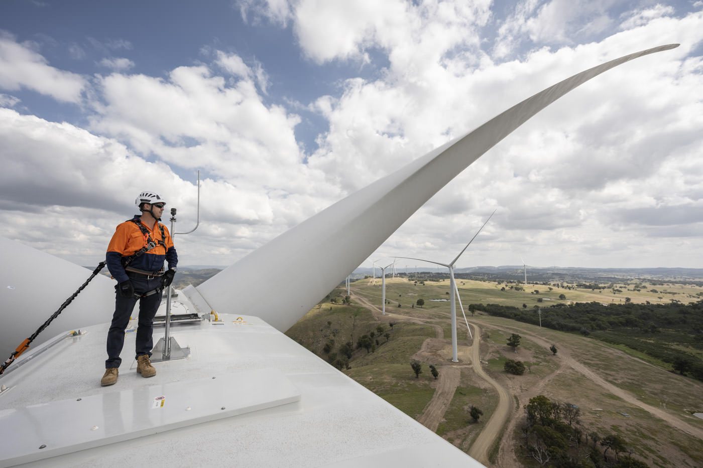 Industrial Photography Industrial Photography of engineer on top of wind turbine